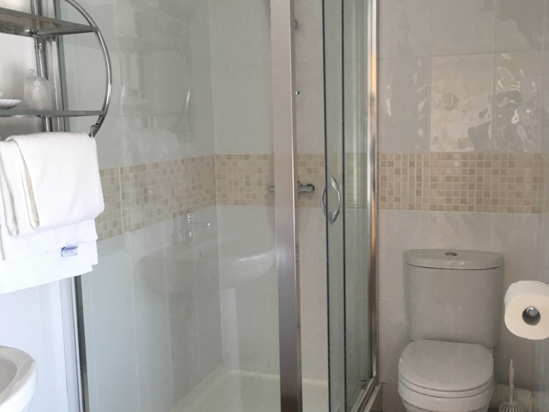 A shower cubicle in one of the en-suite bedrooms at Hartland Quay Hotel