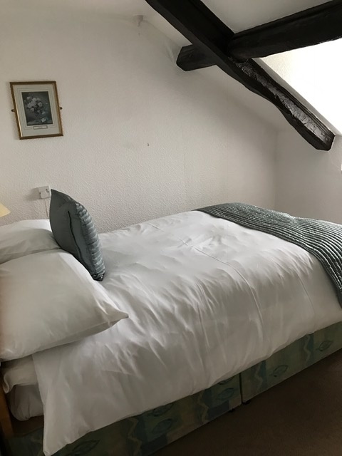 A double bed in the Cottage at Hartland Quay Hotel