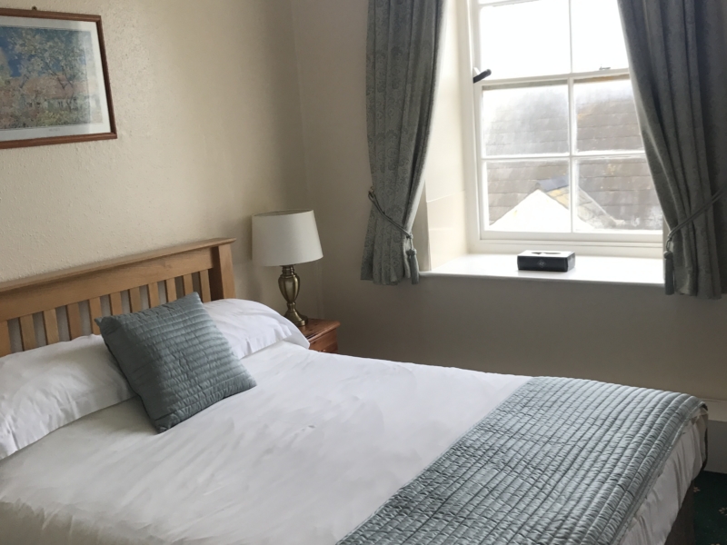 A double bed inside one of the standard rooms in the Hartland Quay Hotel