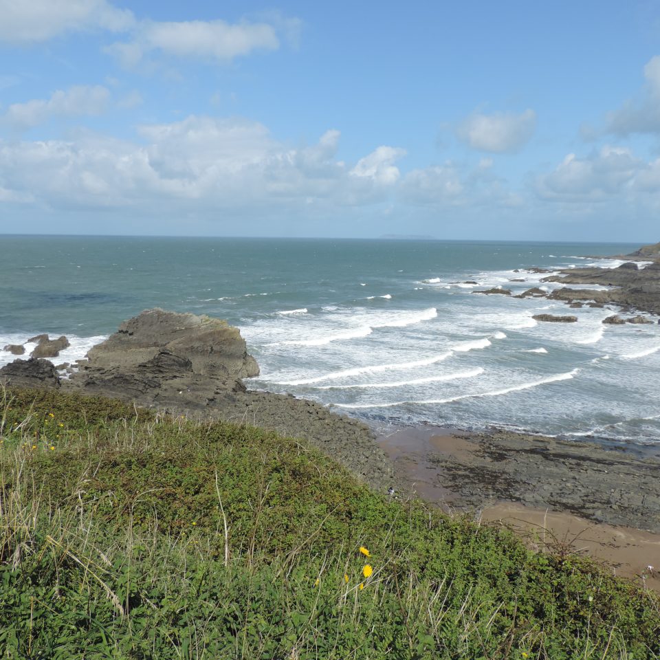 Waves breaking on shore of Hartland Quay