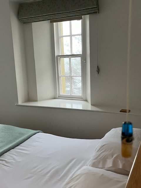 Bed and window in hotel room